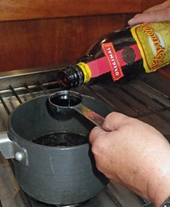 Measuring the Kahlua for the sauce.