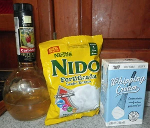 Powdered milk (Nido), heavy cream, and white wine vinegar for the rich ricotta recipe.