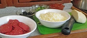 Cheese, pepperoni, olives, green peppers, and home made sauce for toppings.