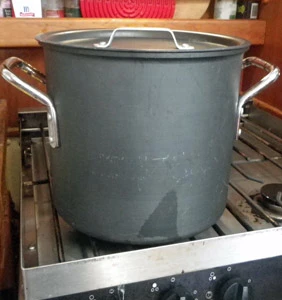 The milk mixture rests until the curd forms.