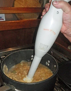 Using the stick blender to puree soup right in the pot.
