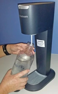 The special Sodastream bottles are easily screwed onto the carbonator.