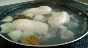 Poach chicken breasts in the morning while its still cool.