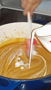 Cream is added to the soup.