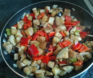Sauteing vegetables for caponata.